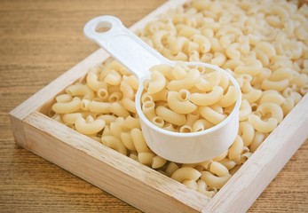 Elbow Macaroni or Gomiti Pasta in Measuring Cup