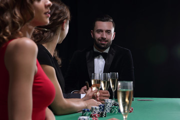 brunette girl in the casino playing poker