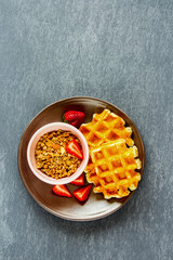 Breakfast with waffles and granola