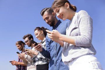 young people using smartphones to search network