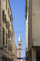 Street with in the background the bell tower of St. Donatus Church, Zadar, Croatia