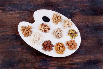 Painter's table with dried fruit on wooden table