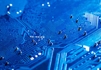 blue circuit board background of computer motherboard © bukhta79
