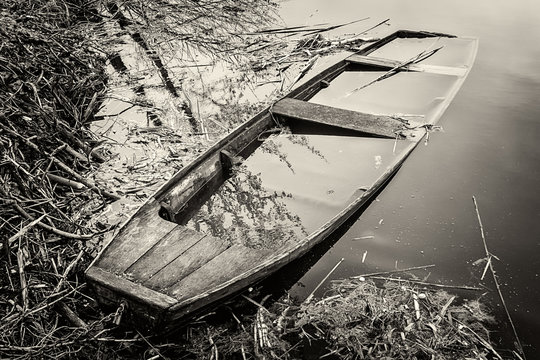old abandoned and submerged boat