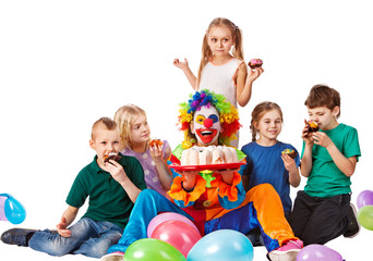 Fototapeta na wymiar Birthday child clown playing with children. Kid holiday cakes celebratory in hands of events organizer man. Fun of group people lying floor on white background. Festive cake in foreground.