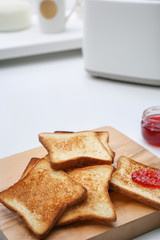 Toasted bread served with jam on table