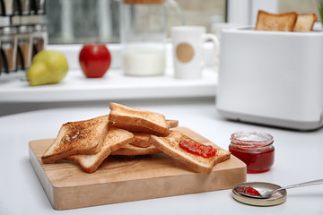 Toasted bread served with jam on table