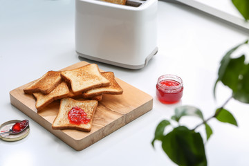 Toasted bread served with jam on table