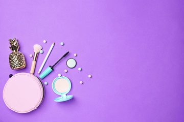 Decorative makeup products on color background