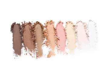 Crushed eye shadows on white background. Professional makeup products