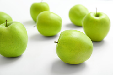 Fresh green apples on white background