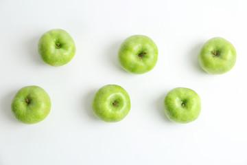 Fresh green apples on white background, top view