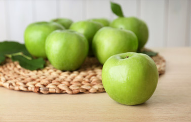 Fresh green apples on table