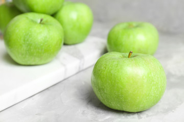 Fresh green apples on table