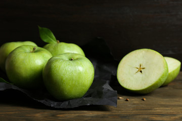 Fresh green apples on wooden table