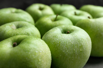 Fresh green apples with water drops, closeup