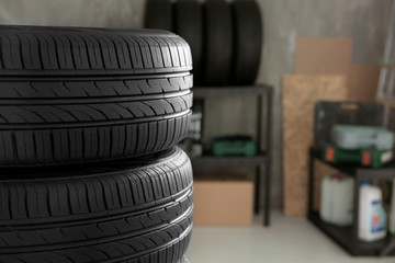 Obraz premium Car tires in automobile service center, closeup