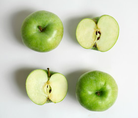Fresh green apples on white background, flat lay