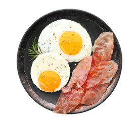 Plate with fried eggs and bacon on white background