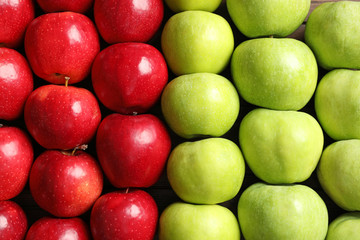 Fresh red and green apples as background