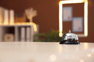 Service bell on reception desk in hotel, closeup