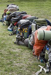 Row of backpacking packs ready for the Chilkoot Trail