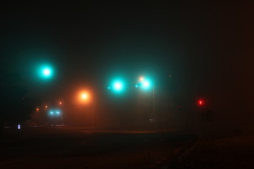 Misty road and traffic lights