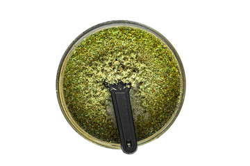 isolated Kief in grinder for weed Trichomes buds of Cannabis macro top view
