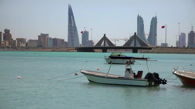 Bahrain. Fishermen Boats, Causeway and Manama Skyline