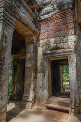Fototapeta na wymiar Siem Reap, Cambodia - August 5th, 2016:Ta Prohm, part of Khmer temple complex, Asia. Siem Reap, Cambodia. Ancient Khmer architecture in jungle.ia. Ancient Khmer architecture in jungle.