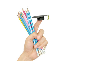 Soft focus hand holding pencil and Graduation hat on white background .Degree education concept