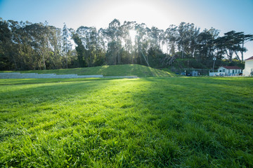 Green grass lawn at sunset time in Golden Gate city park in San Francisco with no people.