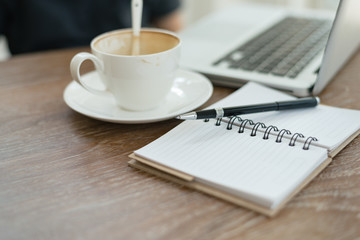 a cup of coffee latte has drank on wooden table