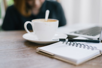 a cup of coffee latte has drank on wooden table