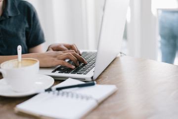 a cup of coffee latte has drank on wooden table