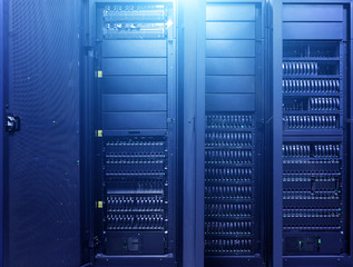 Data Center Computer Cabinet Background. Technologies background. Big data dark server room with...