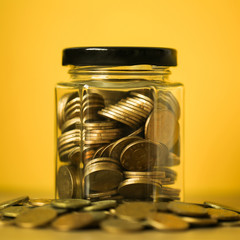 Coins In Glass Money Jar