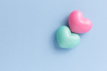 Couple of heart shape over blue table. Romantic Valentine Day concept with copy space