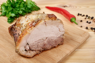cooked roast pork with salad and spices