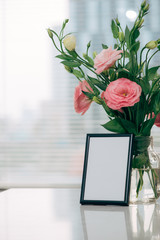 Lisianthus bouquet in the room  with blank note