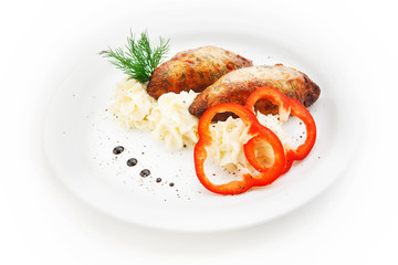 Cutlets with potatoes and paprika on white background