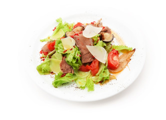 Salad from meat, cheese, tomato, mushrooms and salad leafs on white background