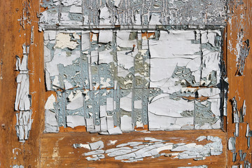 Cracked paint on an old wooden door resembles an abstract painting
