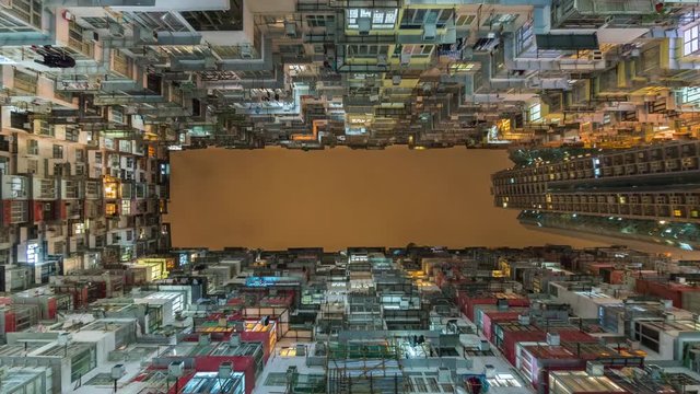 Hong Kong, China, time lapse view of high-rises in Hong Kong, one of the world's most densely populated cities. Zoom in.
