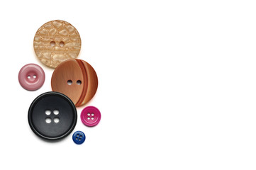 Round buttons of different color, texture and size on a white background