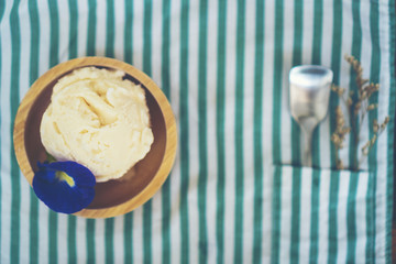 Homemade cherry ice cream on table
