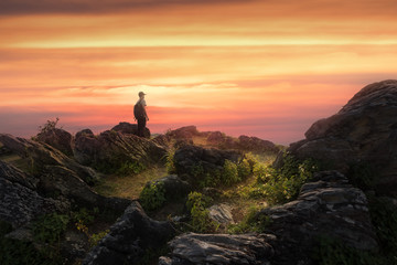 Man on the peak of mountain enjoy sunset view. Travel,hiking,vision concept