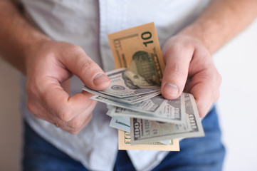 The man counts money in hands