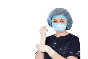 nurse puts on sterile gloves