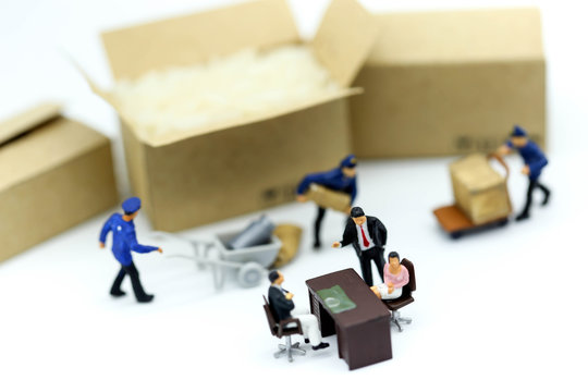 Miniature people : Business team with worker construction background.